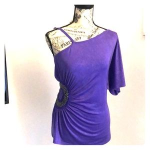 One shoulder embellished top.